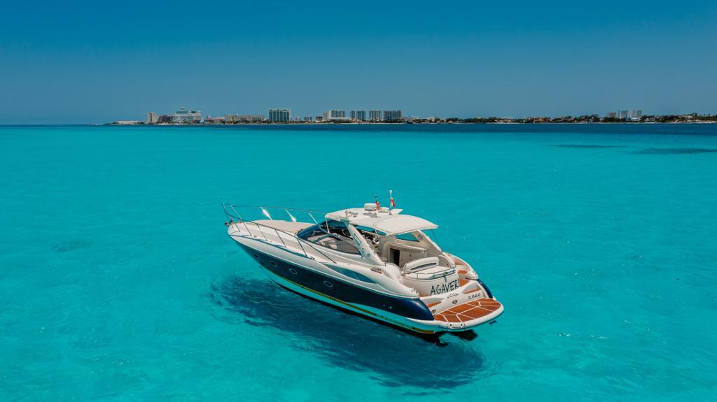 Agavero 44ft six hour private yacht charter cruising in turquoise Cancun water