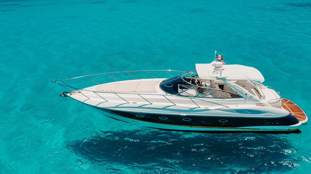 Bow sunpad lounge aboard Agavero 44ft private yacht in Cancun
