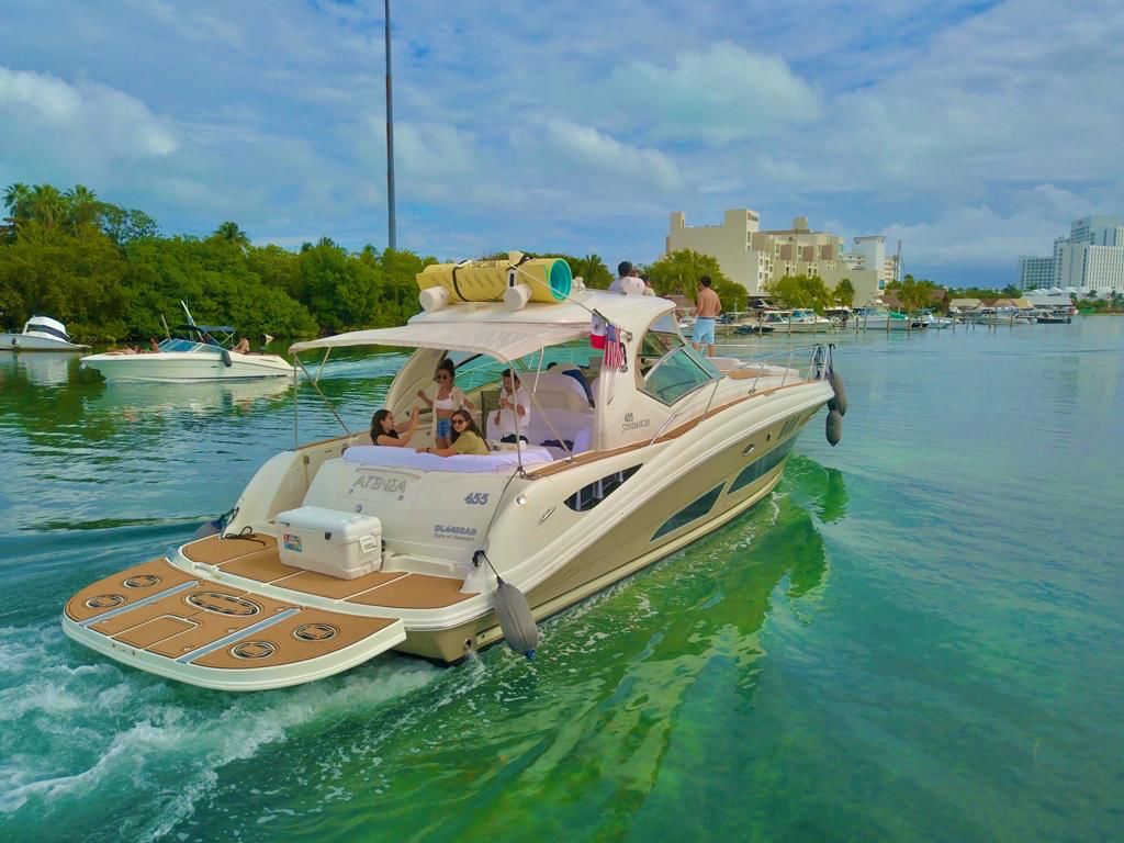 Atenea 46ft private yacht charter cruising in Cancun turquoise water
