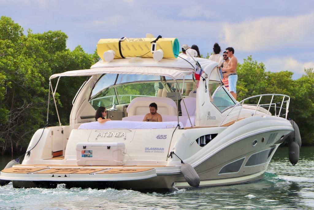 Guests enjoying the stern social area aboard Atenea 46ft in Cancun