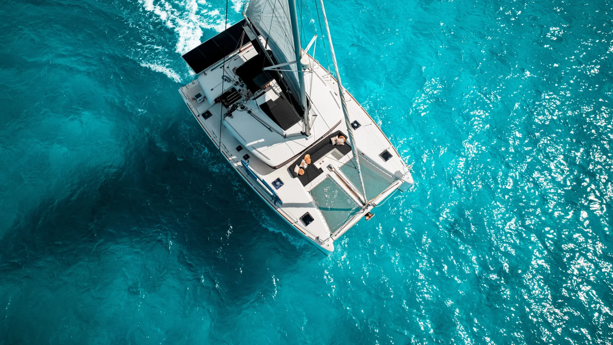 Aerial view of Beluga Catamaran over turquoise water in Cancun