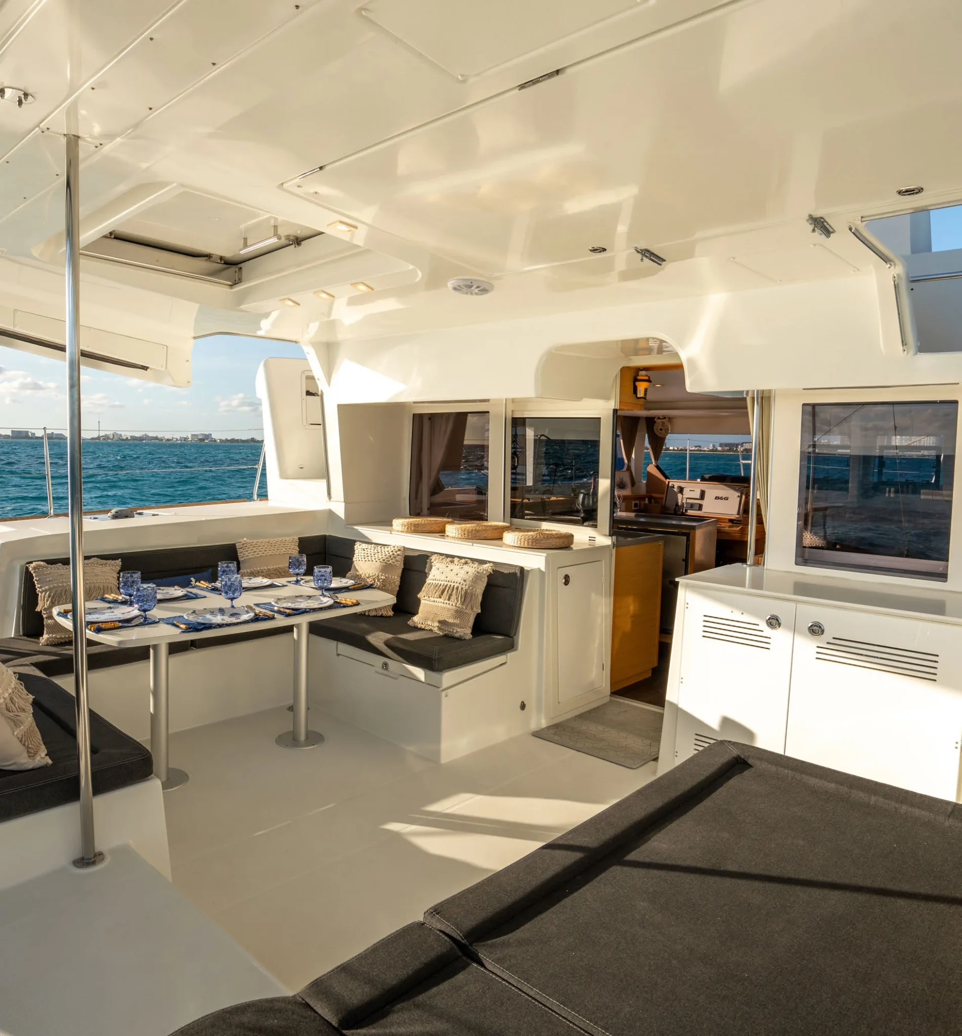 Covered cockpit and shaded dining space aboard Beluga Catamaran in Cancun