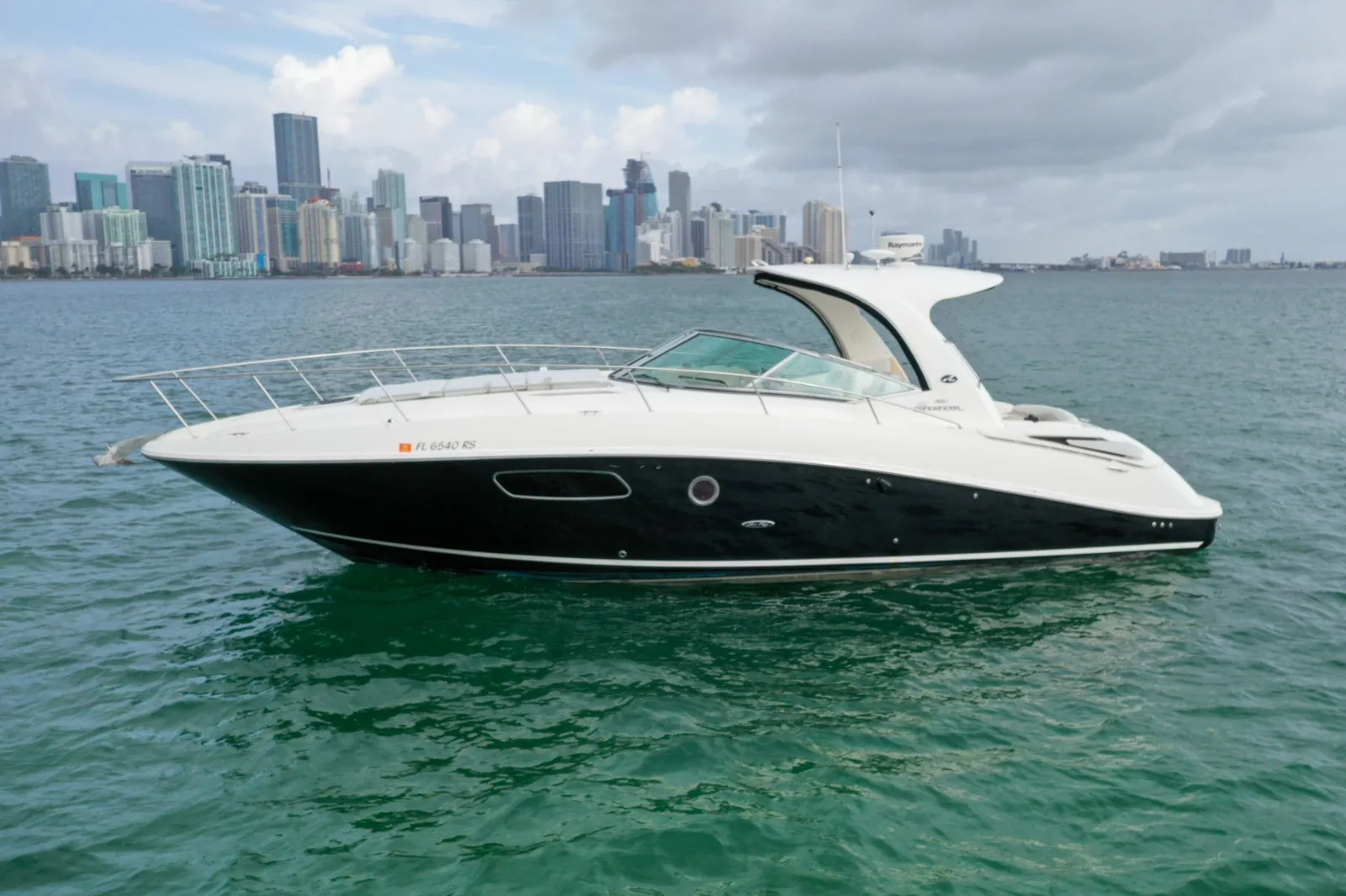 Regina 40ft aerial stern-quarter view cruising in Cancun