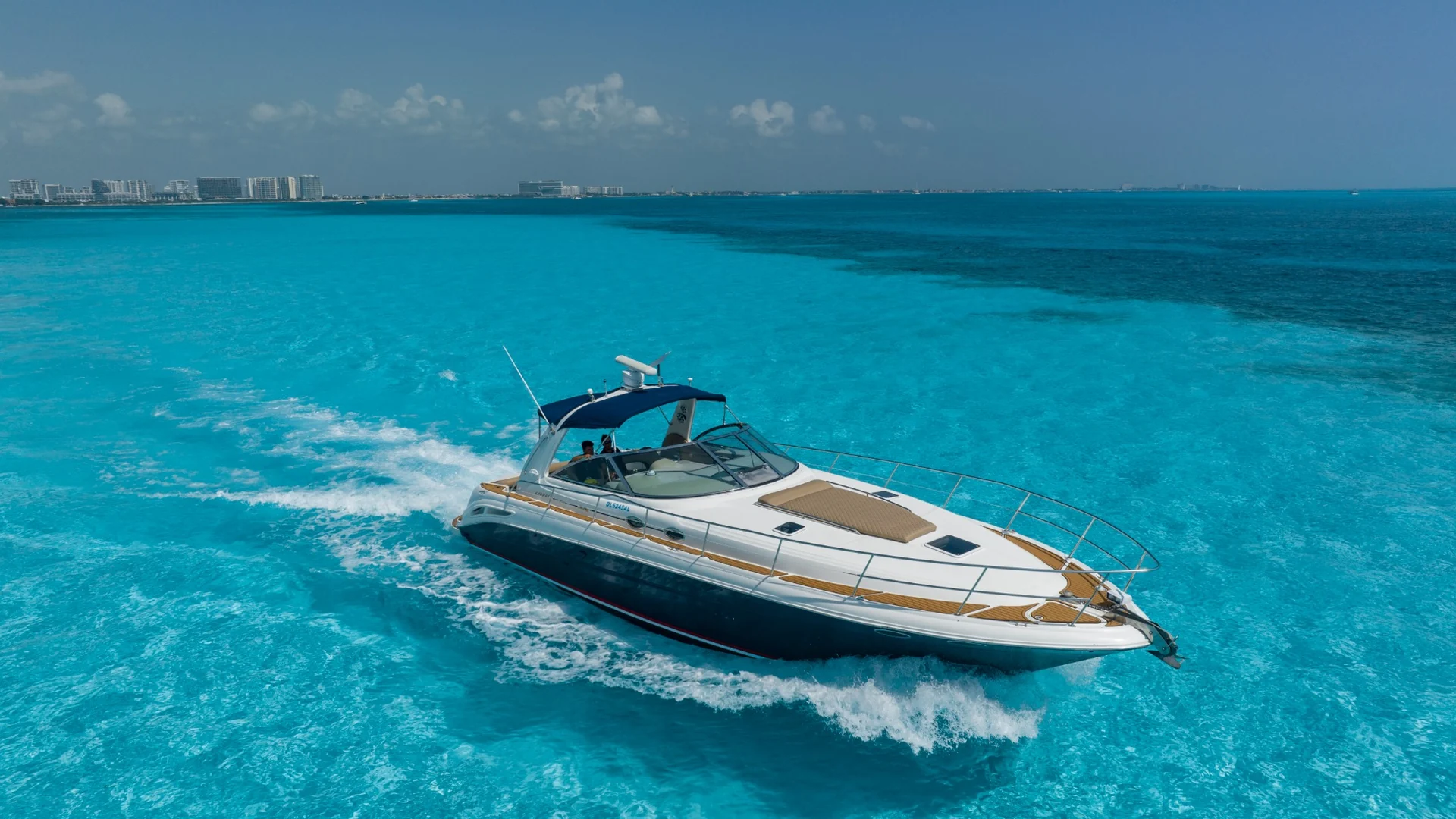 ATM 45ft private yacht charter Cancun cruising over turquoise Caribbean water