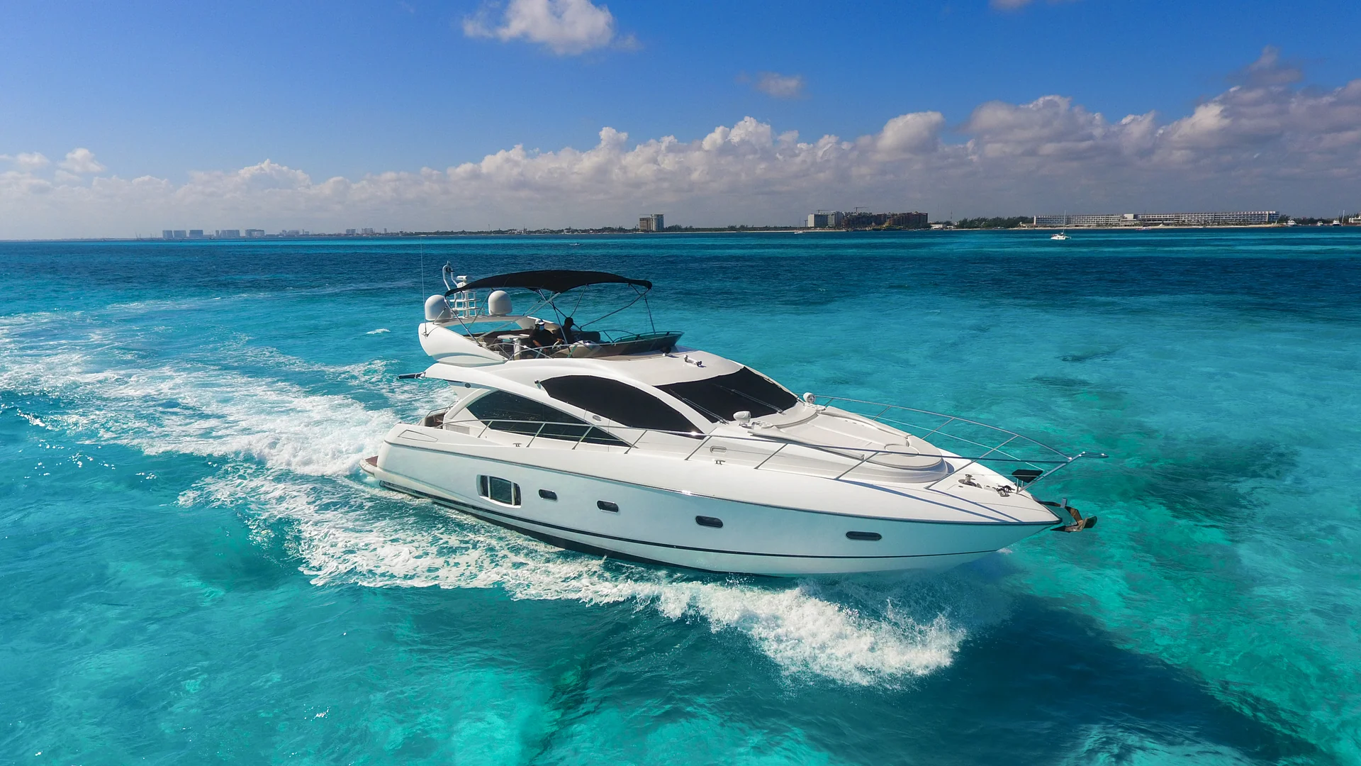 Ave Stella 64ft private yacht charter Cancun cruising over turquoise Caribbean water