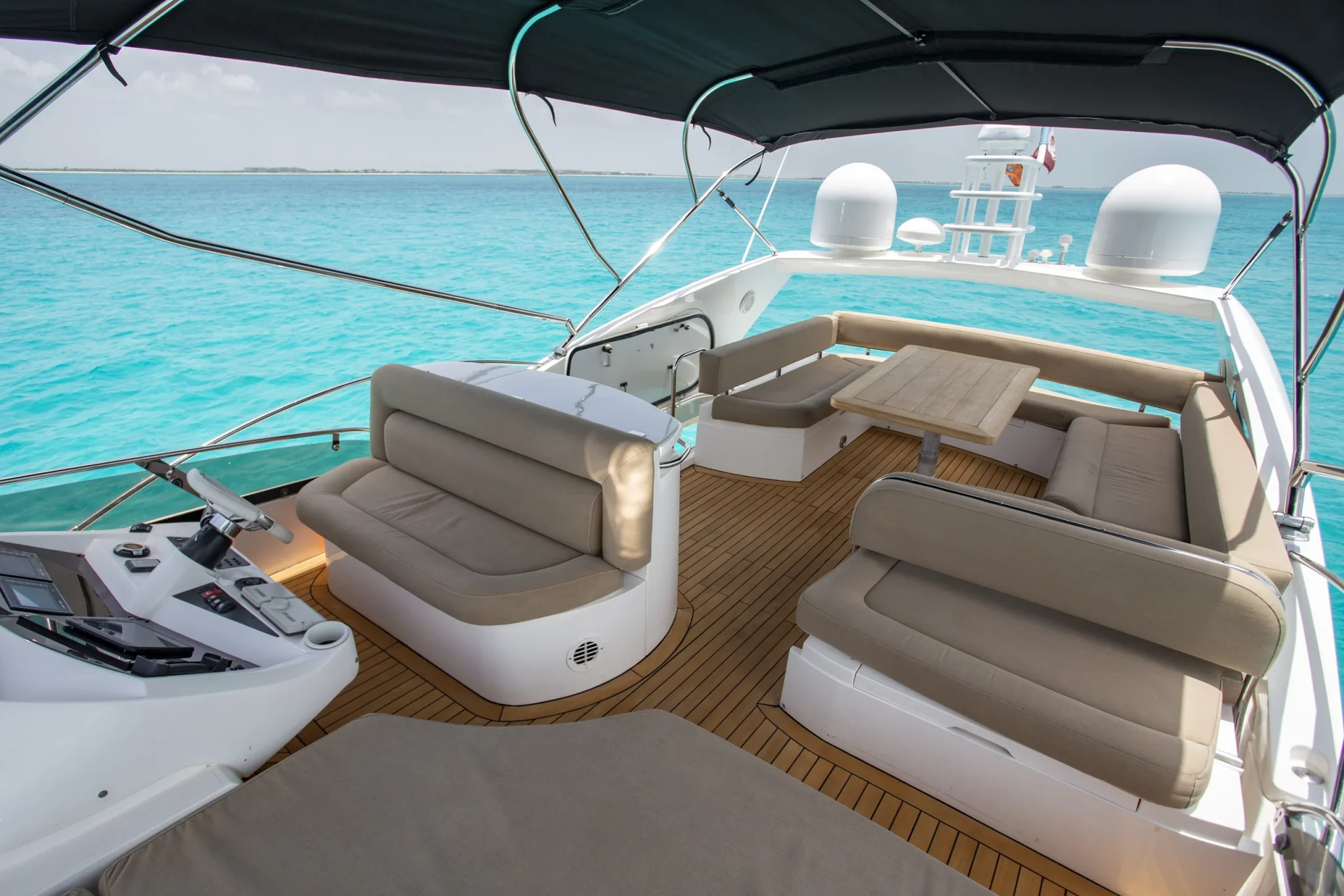 Ave Stella 64ft Sunseeker private yacht charter in Cancun showing side deck ocean view.
