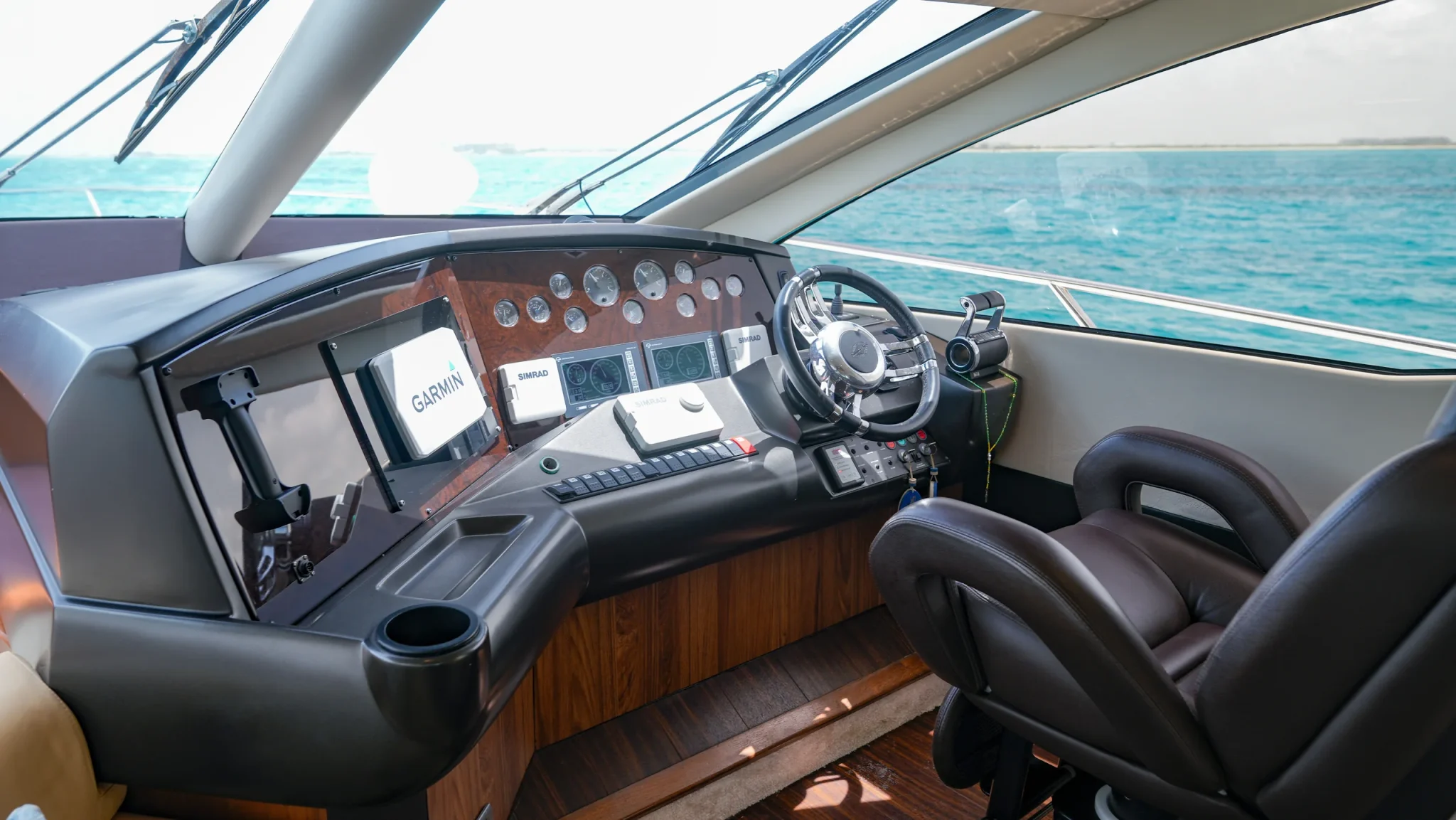 Ave Stella 64ft Sunseeker private yacht charter in Cancun showing flybridge helm seating.