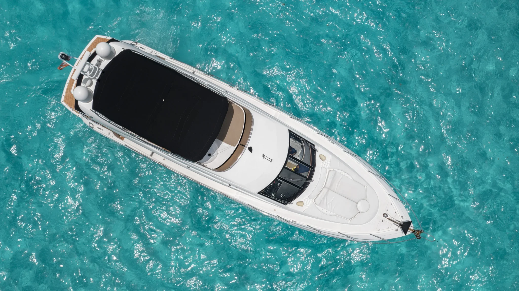 Ave Stella 64ft Sunseeker private yacht charter in Cancun showing top-down aerial cruising view.