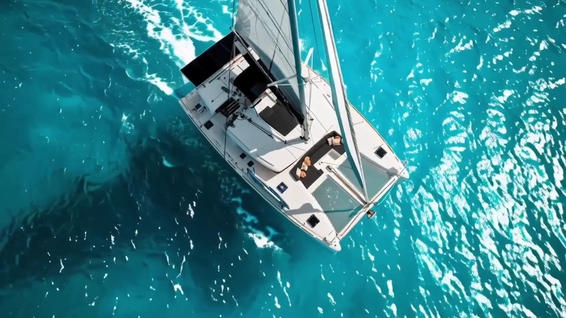 Beluga 450F private catamaran cruising in turquoise Cancun water for an ILWYV luxury yacht charter