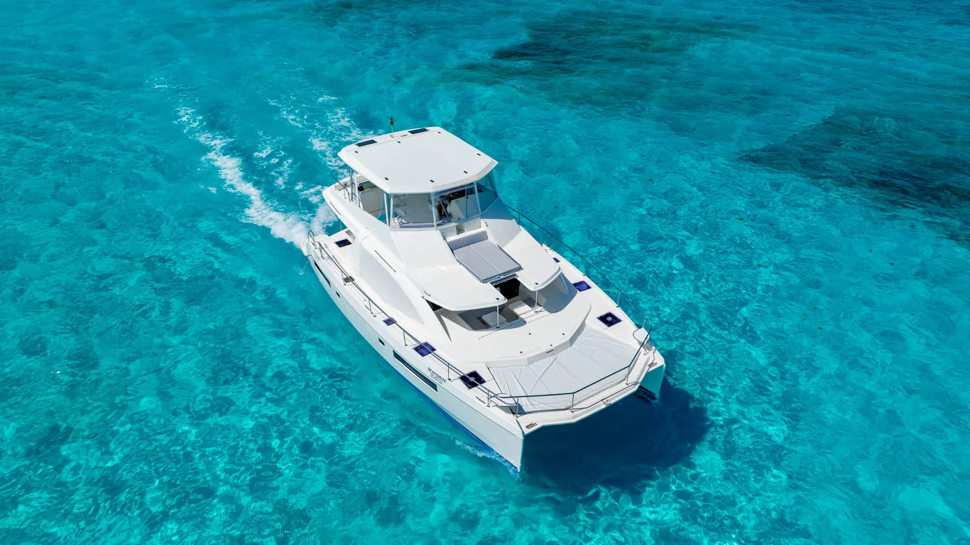 Blondie 51ft Leopard aerial bow-quarter view in Cancun