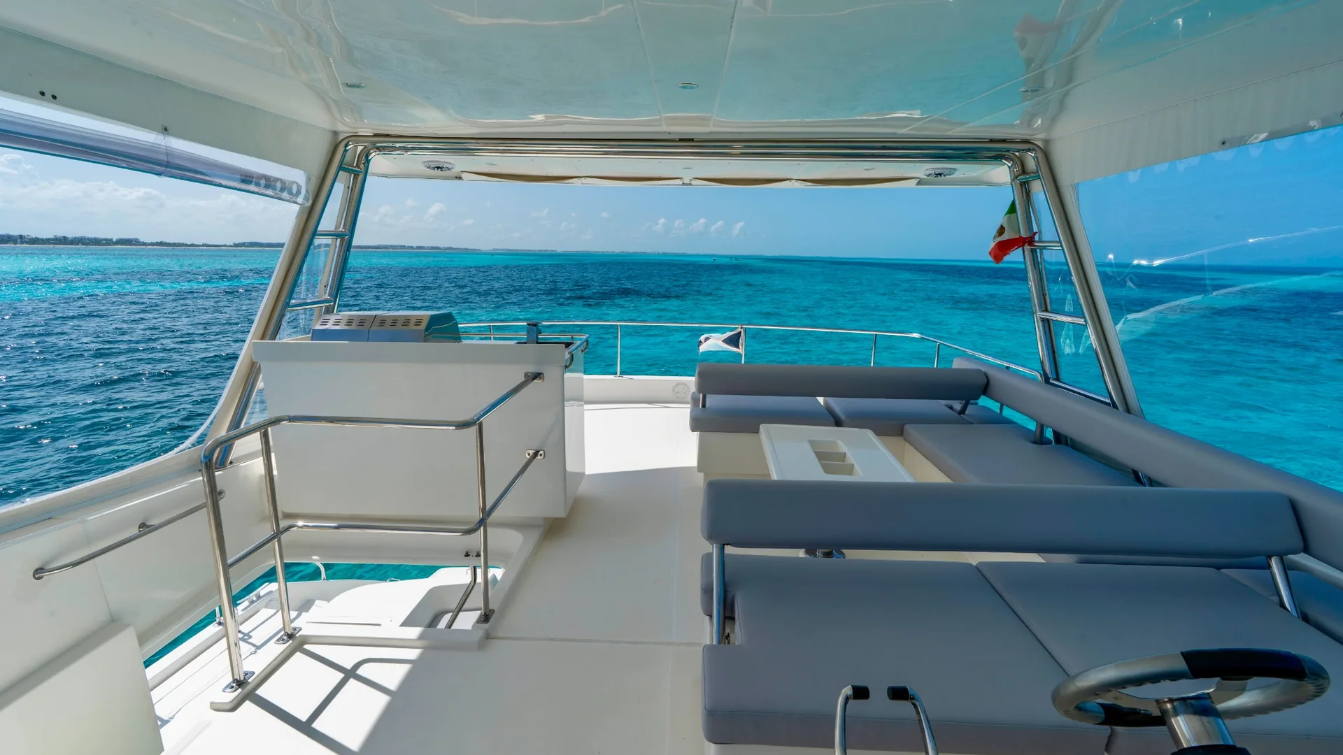 Blondie 51ft Leopard covered flybridge lounge with ocean view