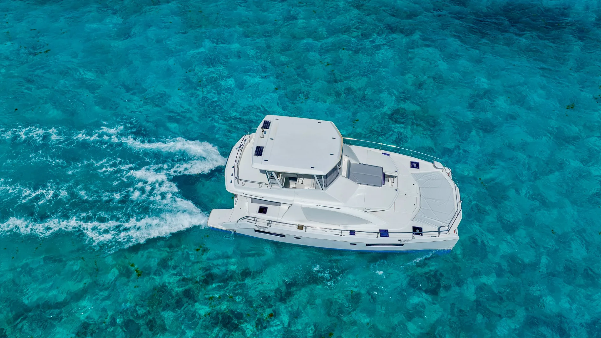 Blondie 51ft Leopard top-down aerial cruising view in Cancun