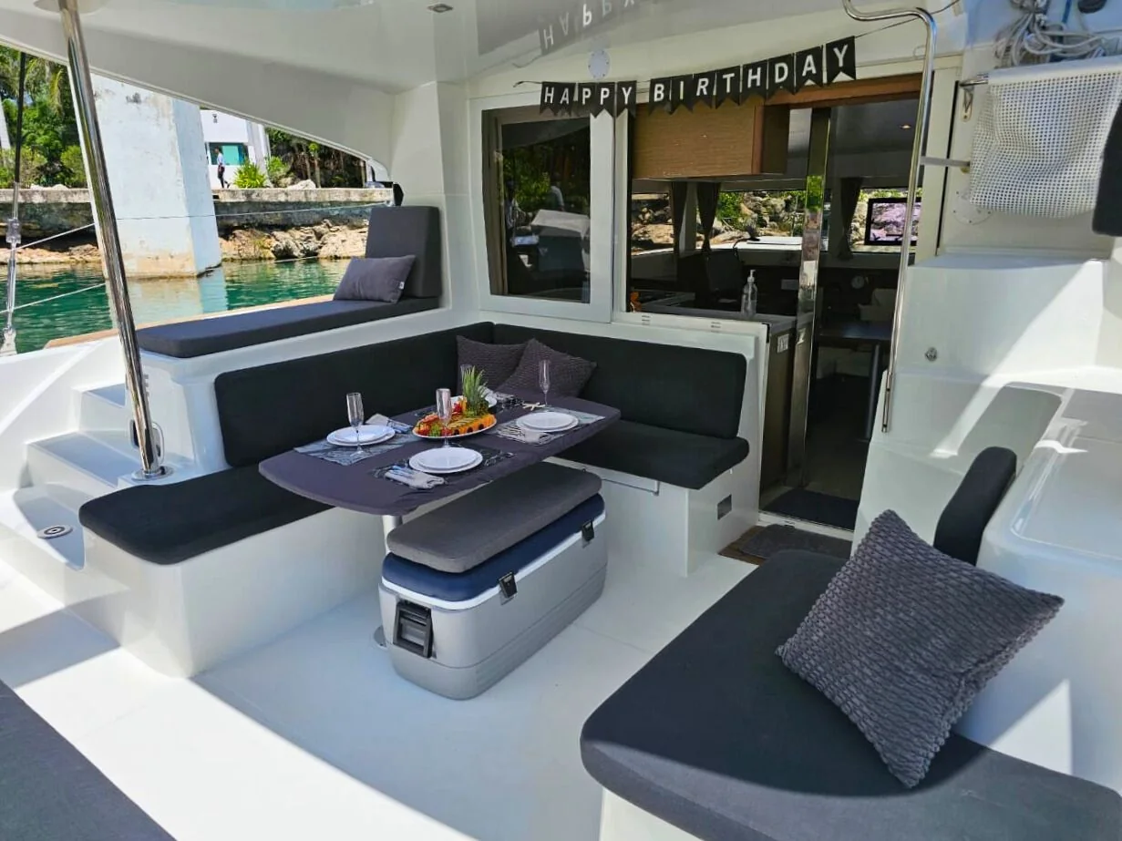 Aft dining area prepared for a private celebration aboard Blue Iris 40ft Lagoon Catamaran.