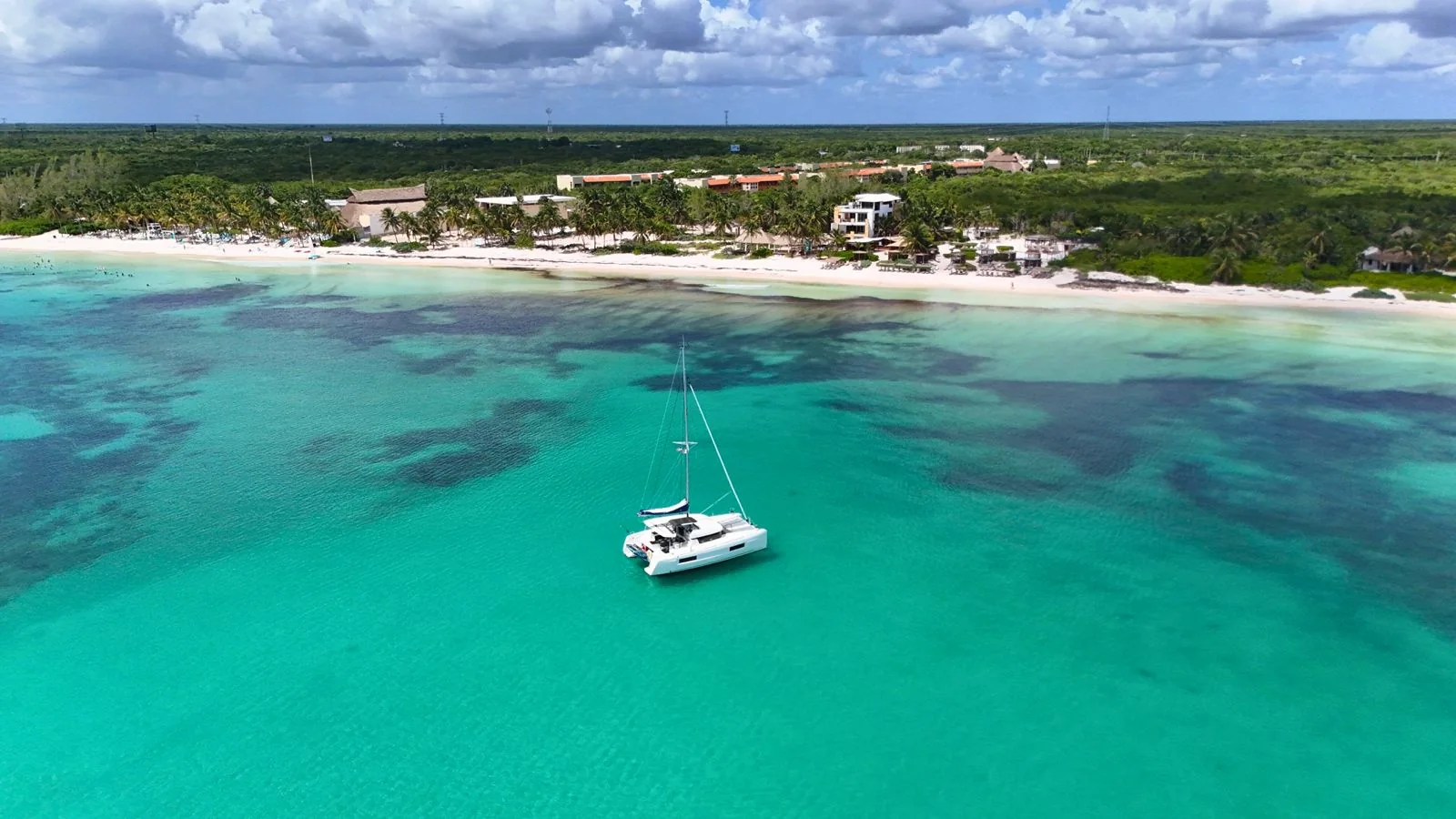 Blue Iris 40ft Lagoon Catamaran near the Riviera Maya coastline.