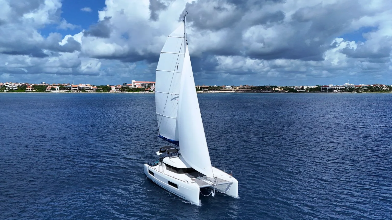 Blue Iris 40ft Lagoon catamaran sailing in Riviera Maya blue water