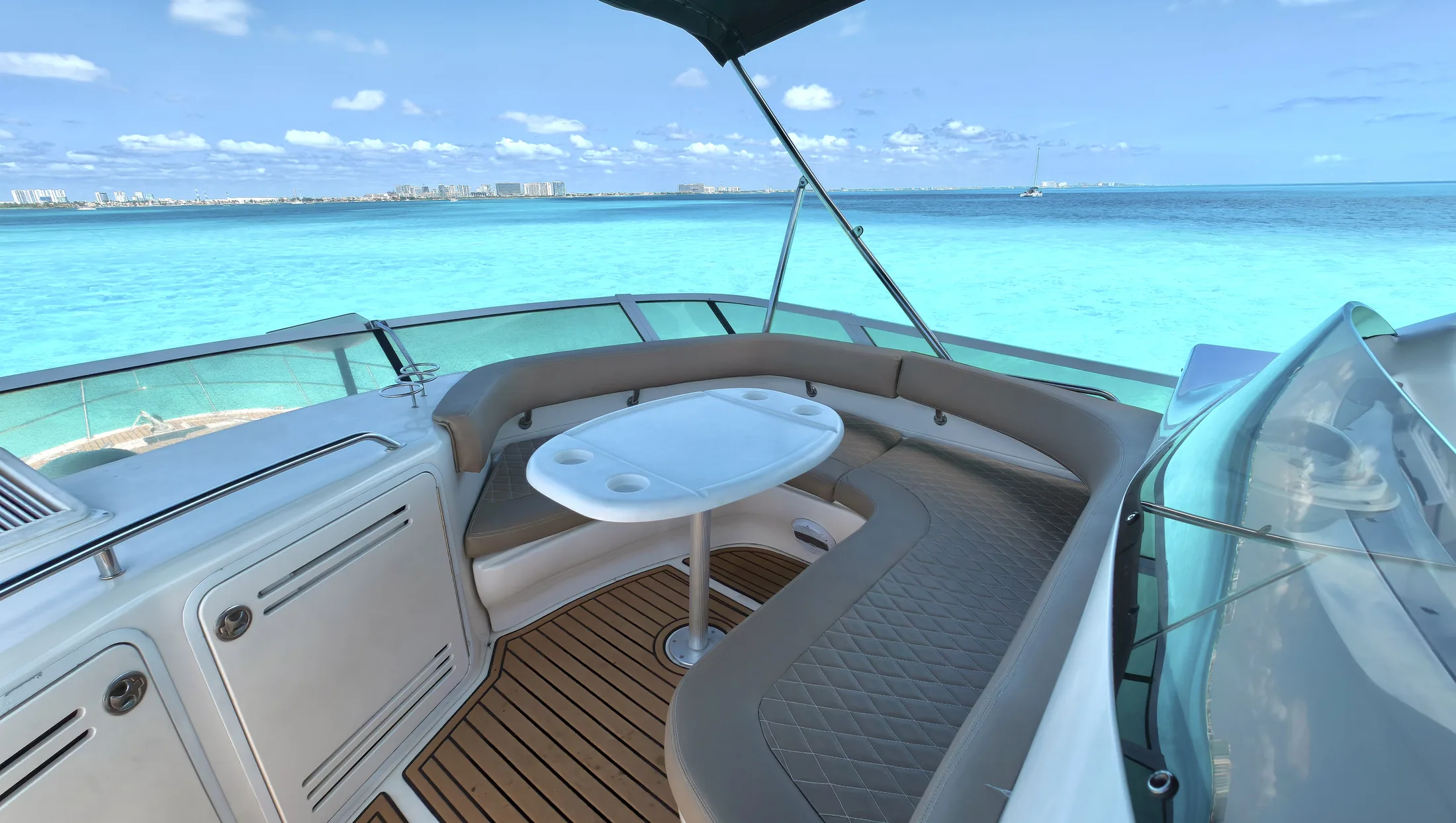 Carpe Diem 52ft Sea Ray private yacht charter in Cancun showing aft cockpit lounge table.