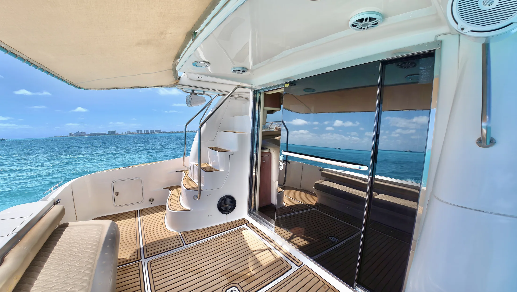 Carpe Diem 52ft Sea Ray private yacht charter in Cancun showing aft deck and salon entry.