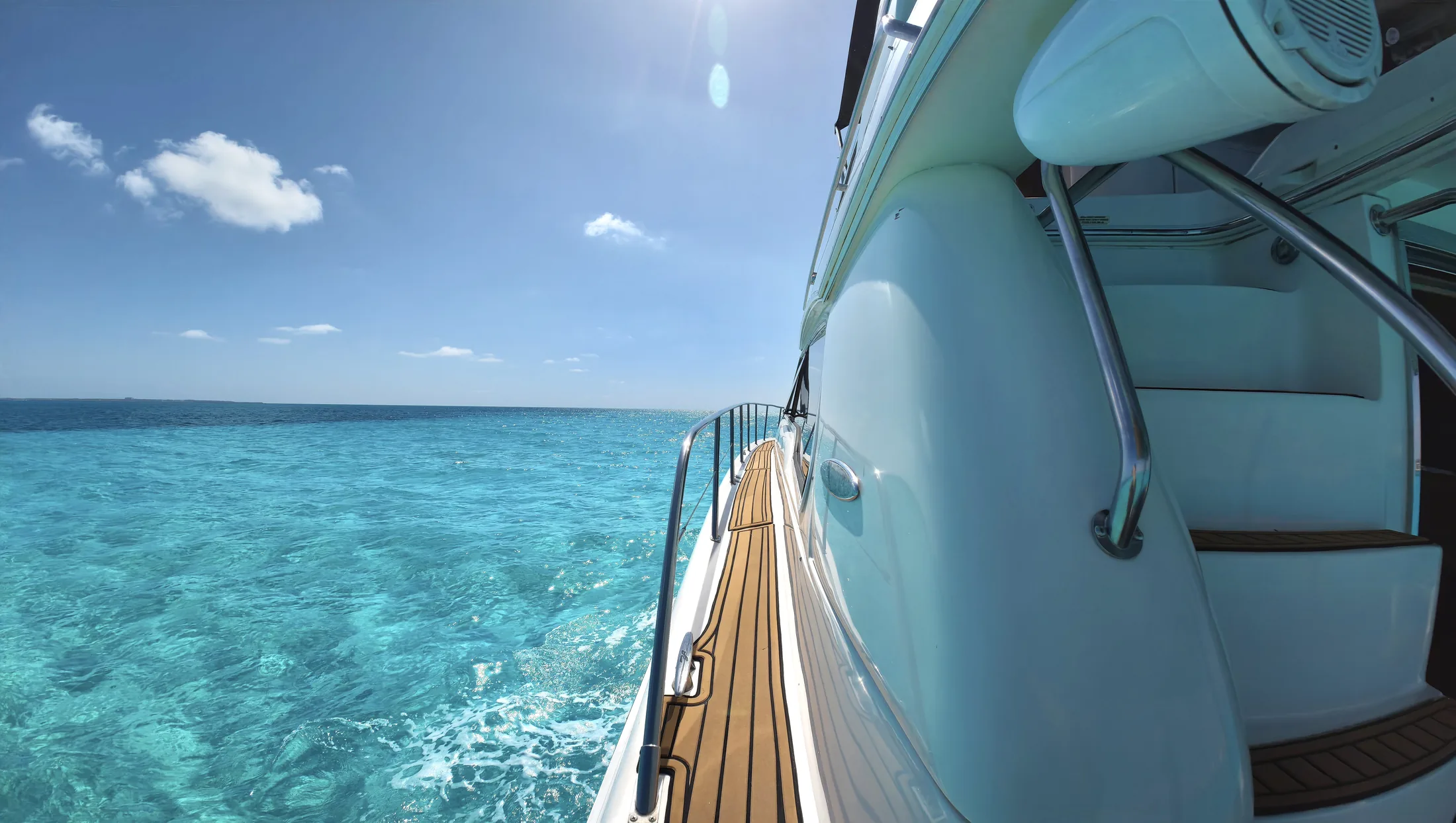 Carpe Diem 52ft Sea Ray private yacht charter in Cancun showing side deck ocean view.