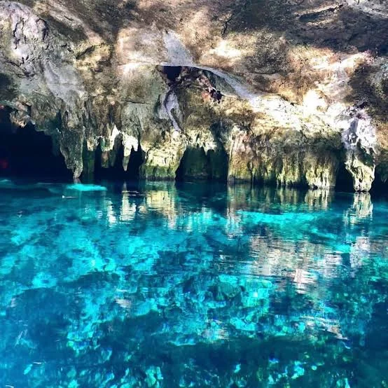 Cavern cenote with turquoise water at Casa Tortuga Tulum