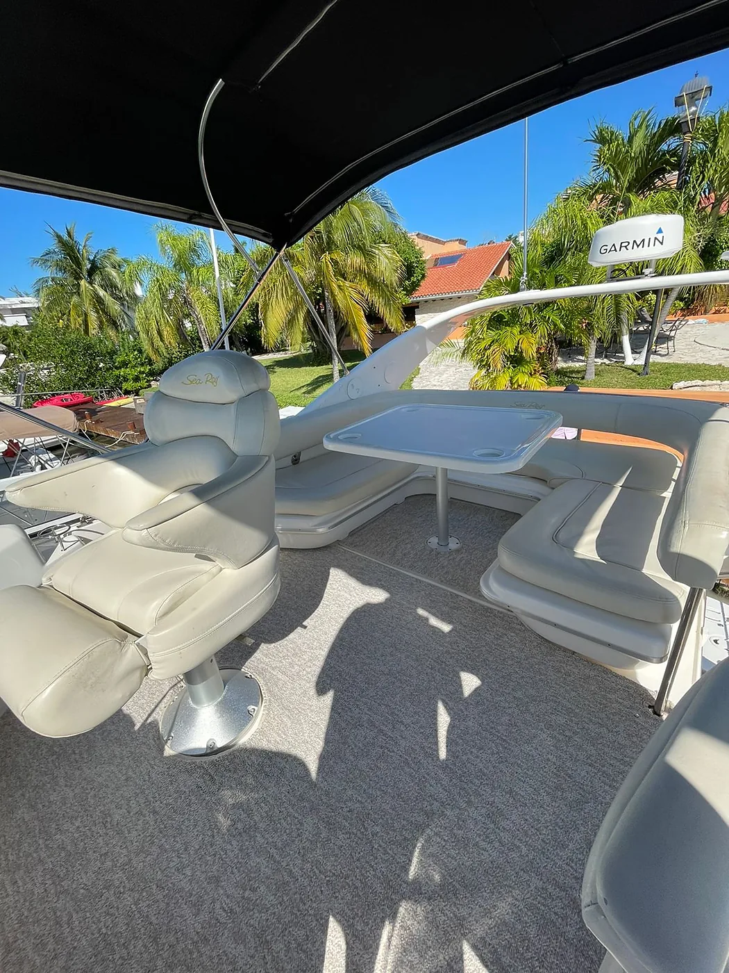 Flybridge seating area and table on Magnus 40ft yacht