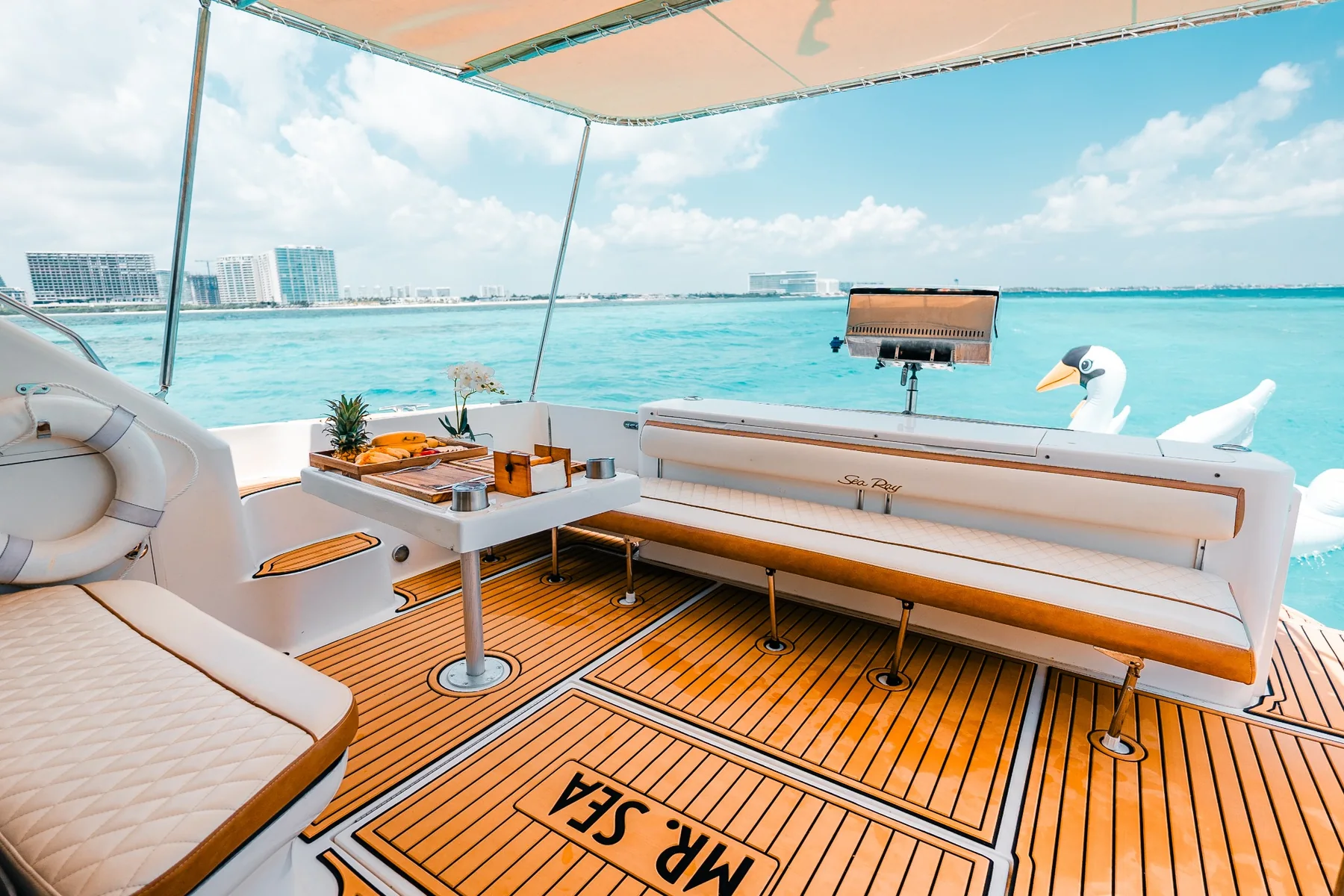 Aft deck lounge with sea view aboard Mr Sea 50ft yacht in Cancun