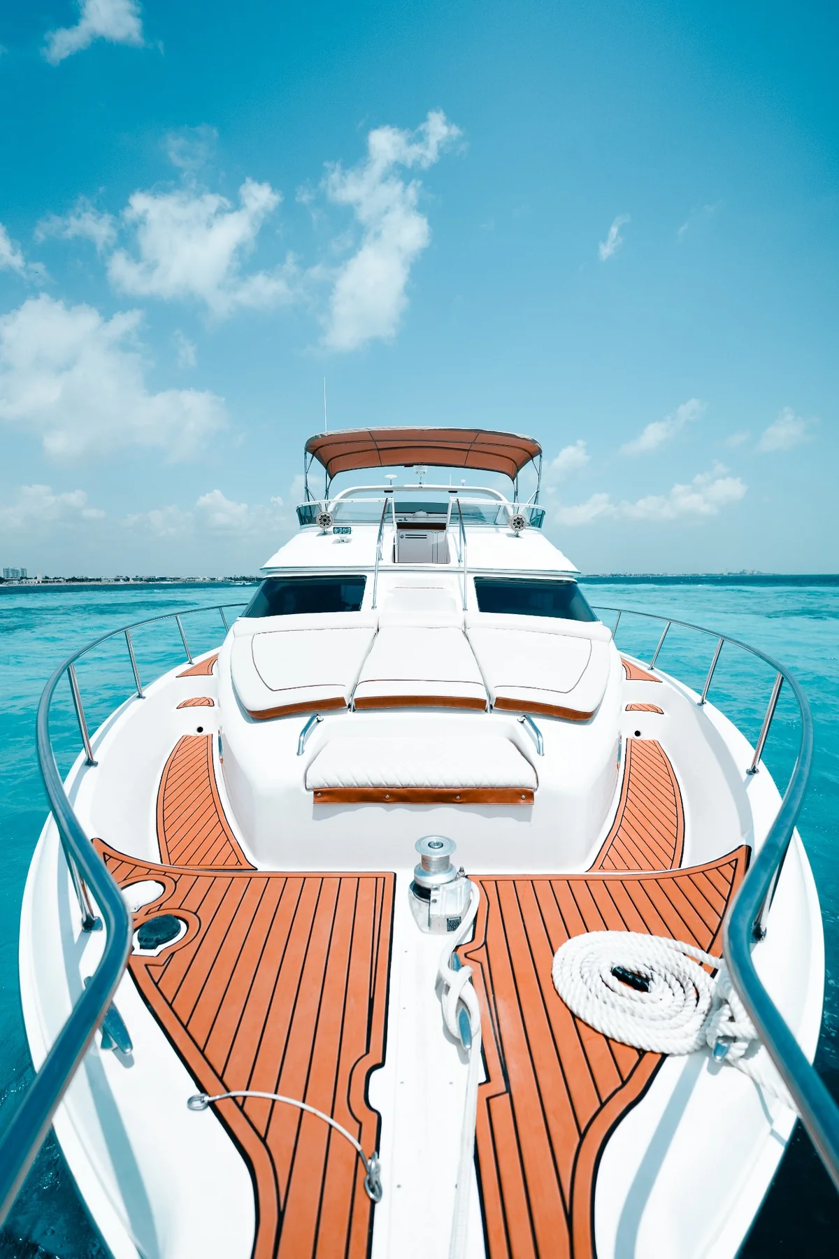 Bow sunpad aboard Mr Sea 50ft yacht over turquoise water in Cancun