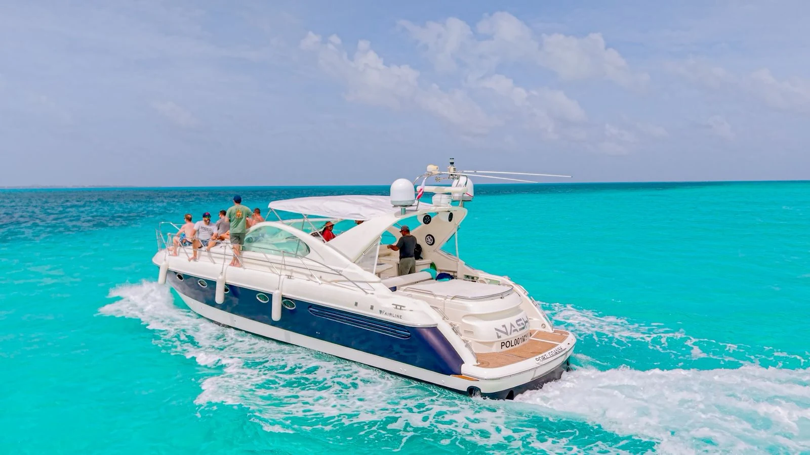Stern view of the Nash 52ft yacht underway in Cancun with bright turquoise water and open sea views.