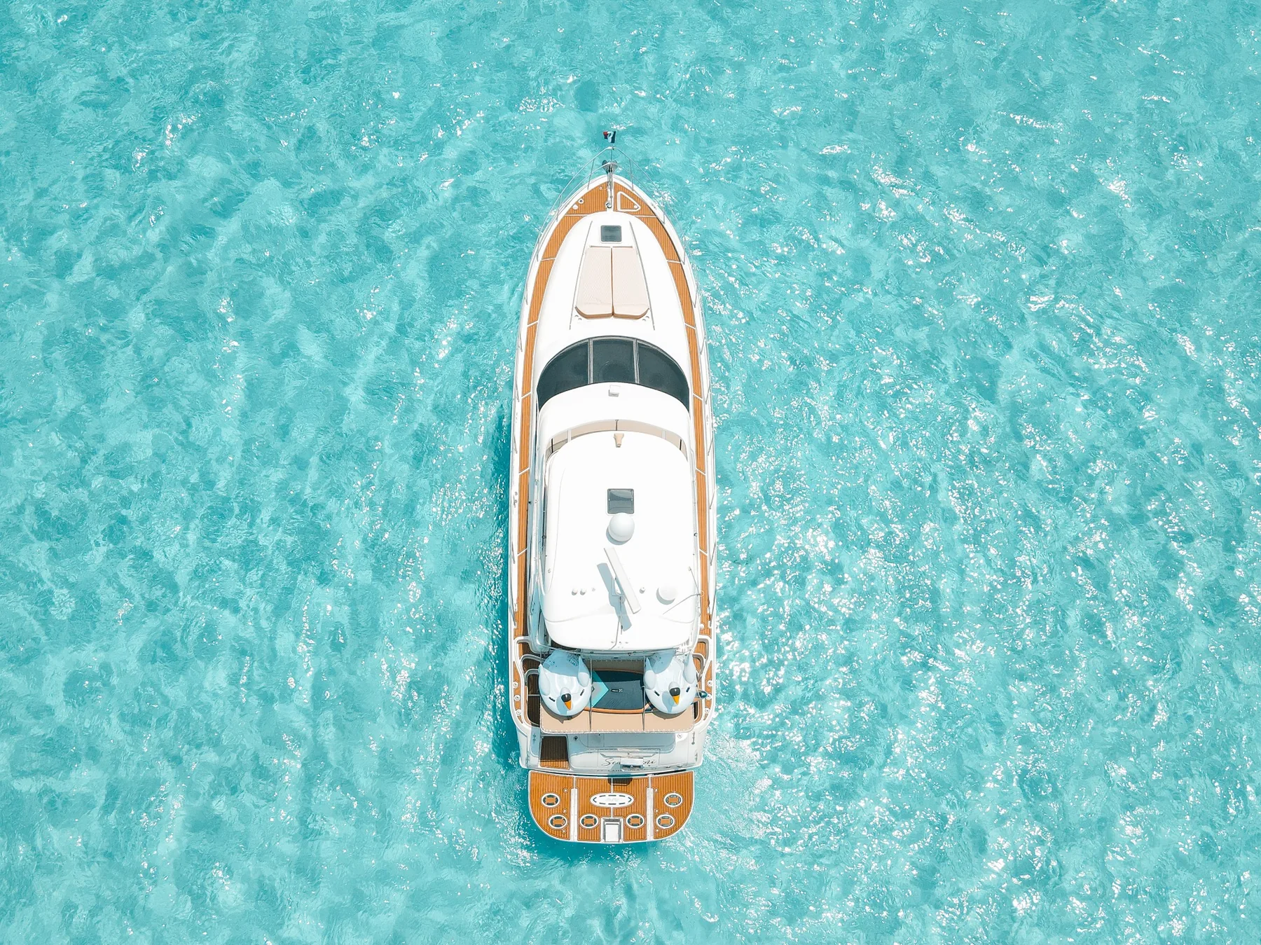 Aerial top view of Sea Mami yacht in crystal-clear Cancun water