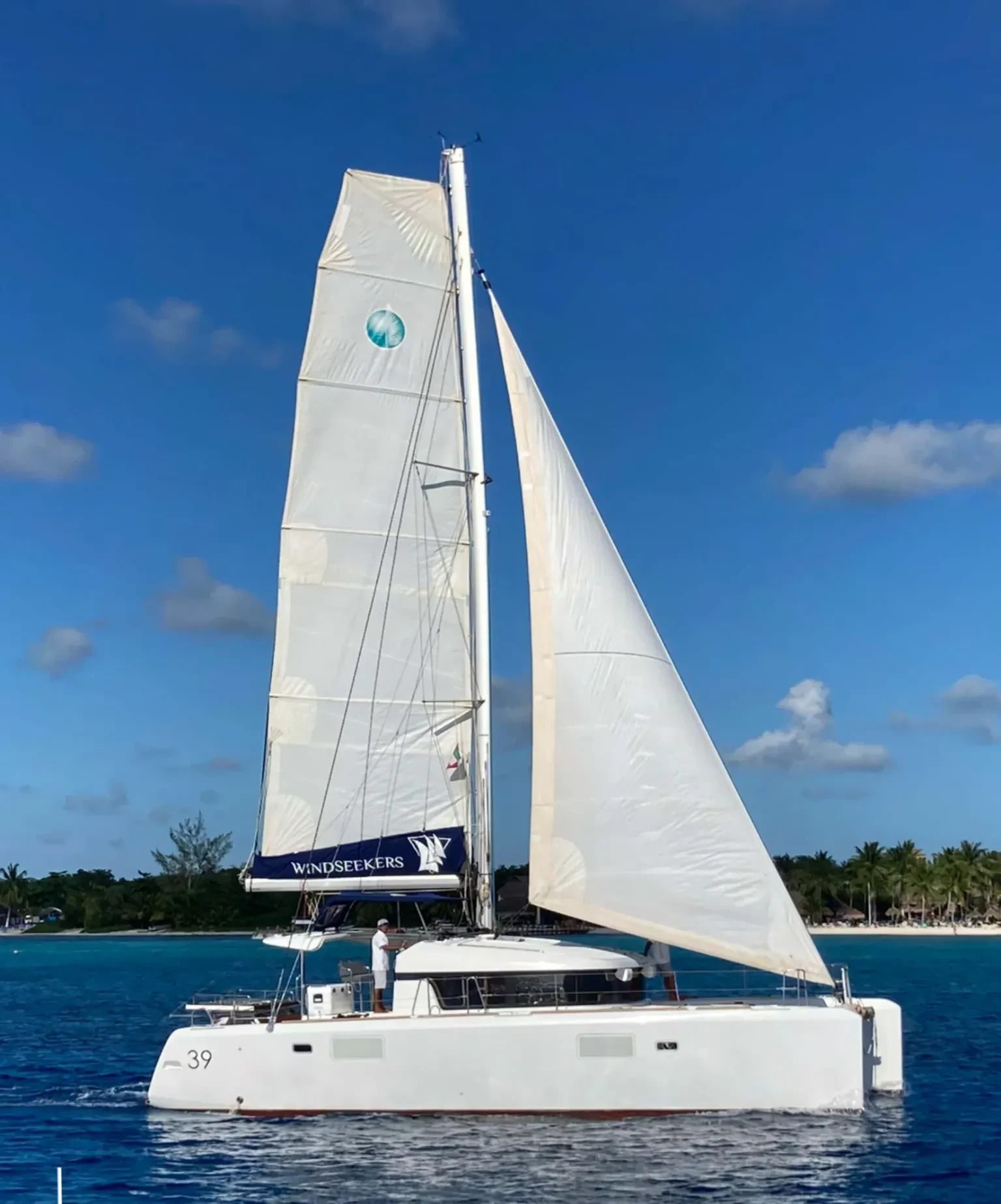 Lidia 39ft Lagoon Catamaran side profile sailing in Cozumel