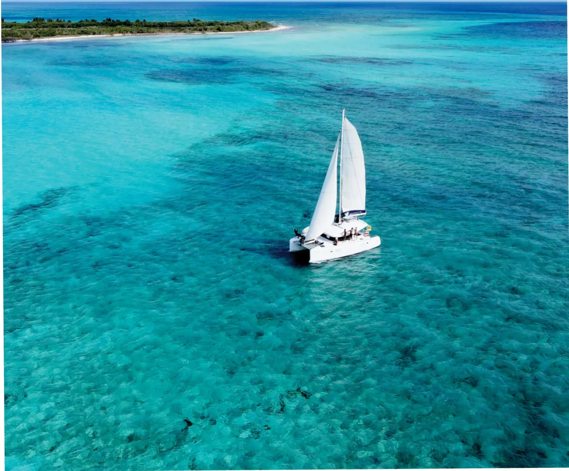 Lidia catamaran aerial view over turquoise Cozumel water