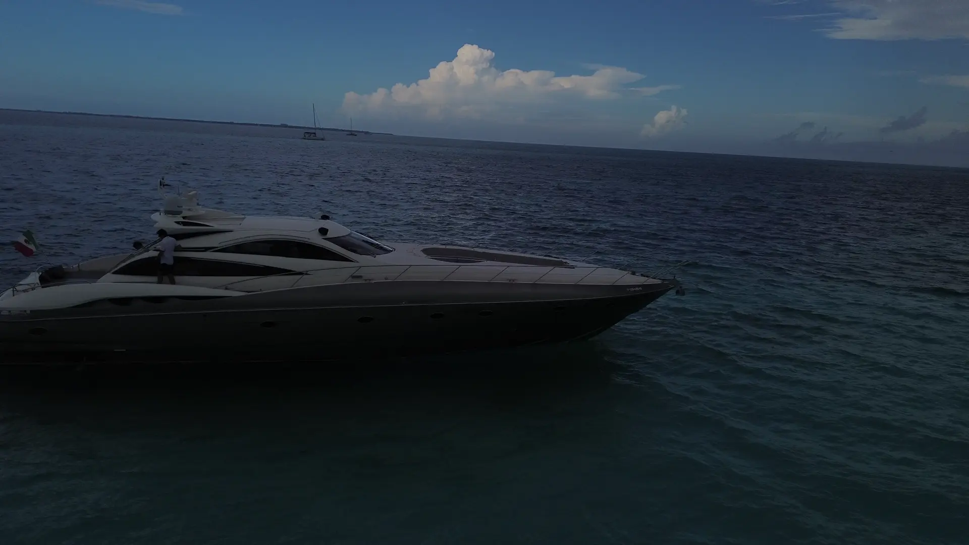 Sunseeker Predator 75ft luxury yacht charter in Cancun turquoise water