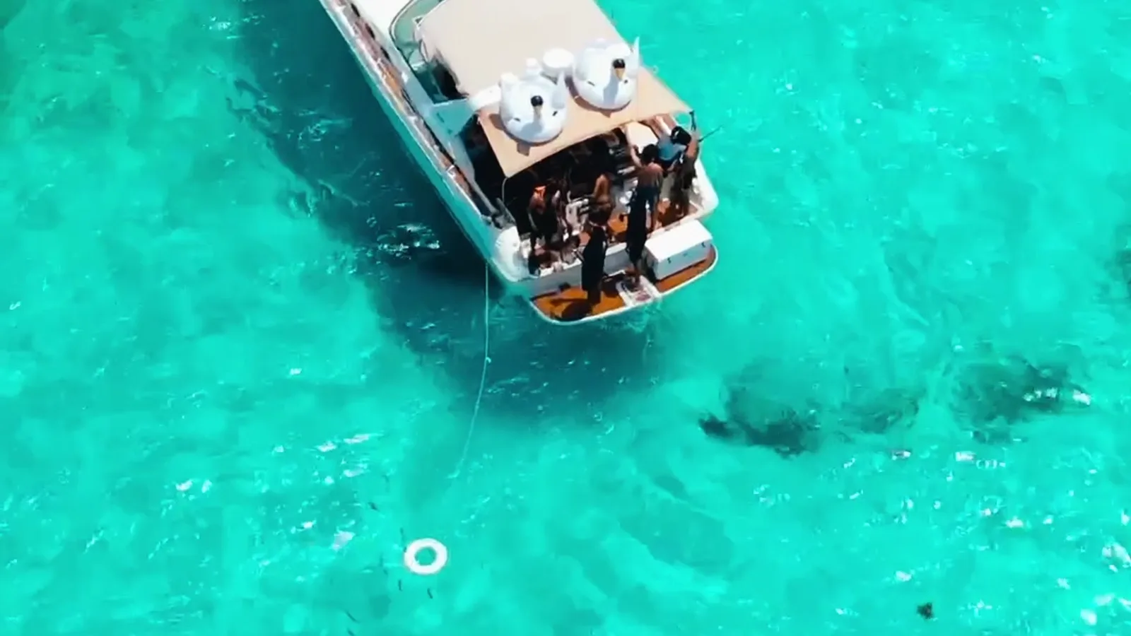 Tata 40ft private yacht anchored in turquoise water in Cancun