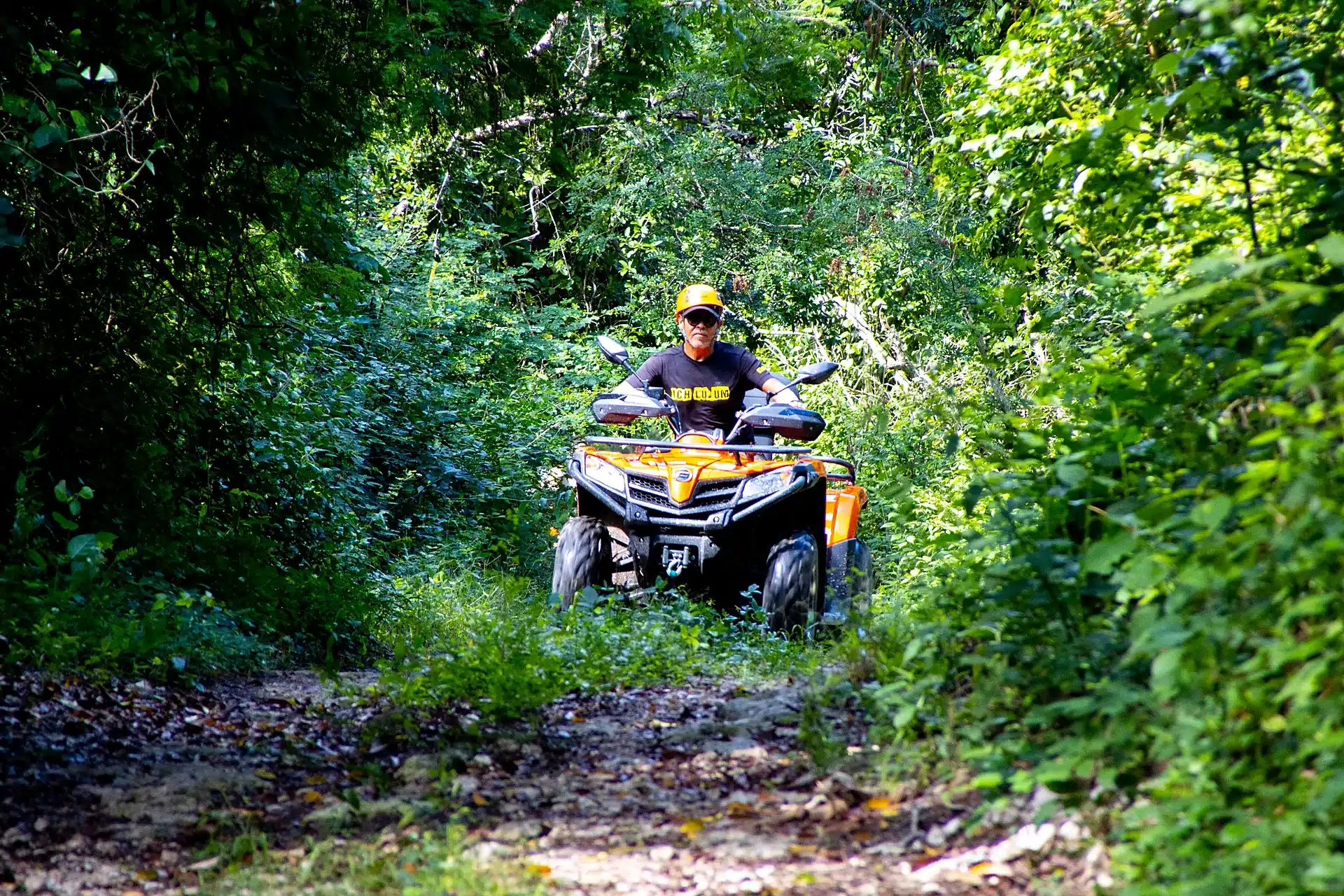 Single ATV riding through jungle trail at Tortuga Xtreme Tulum