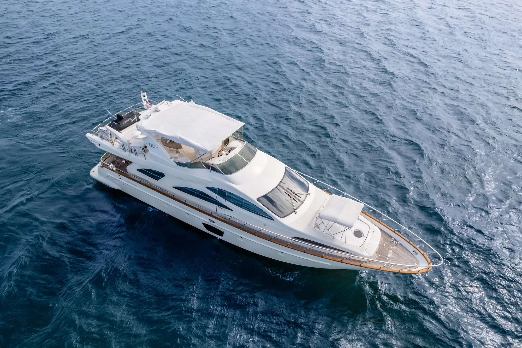 Truco II 80ft Azimut yacht aerial view over deep blue Cancun water