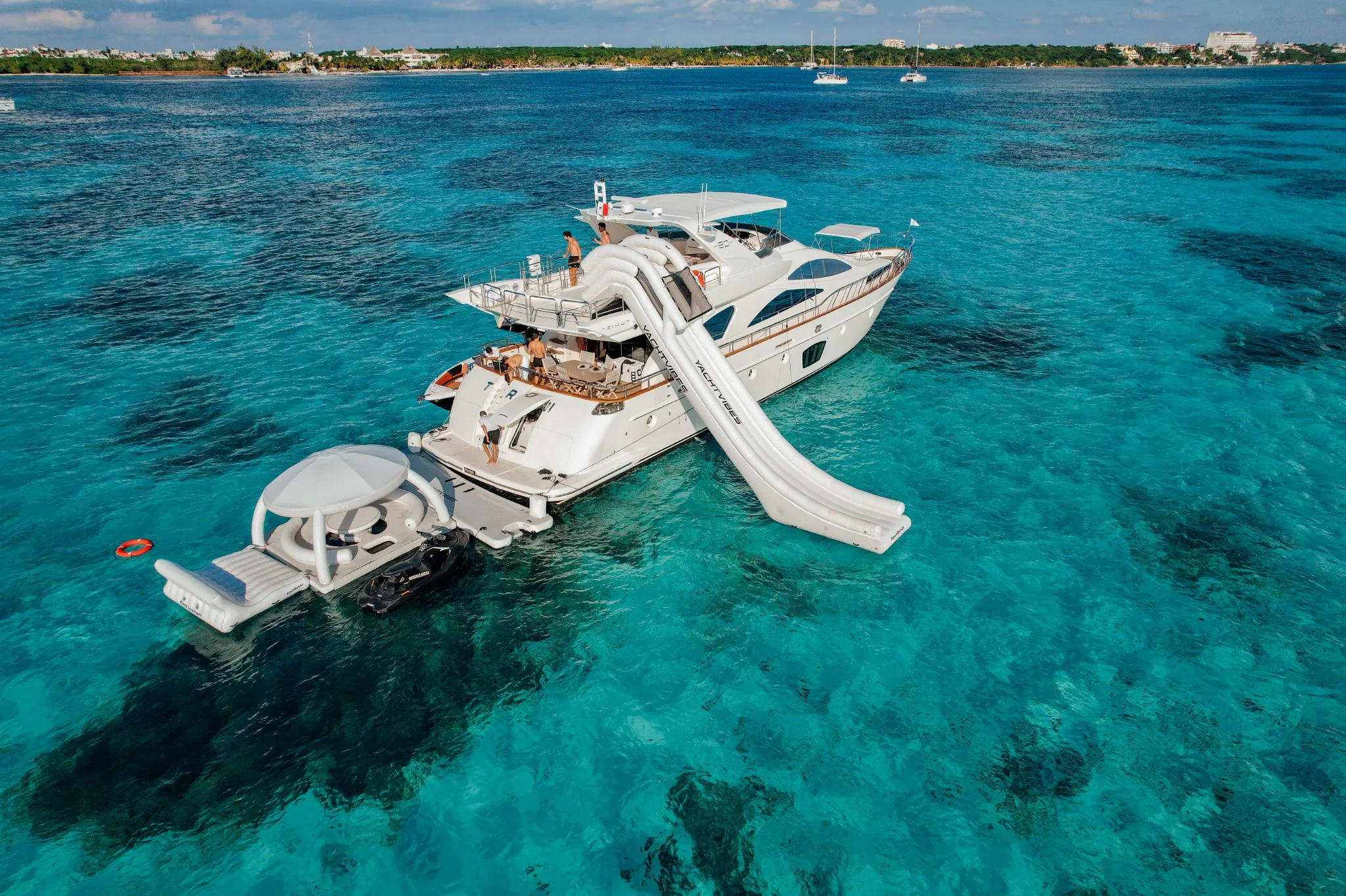 Truco II 80ft yacht with water slide near Isla Mujeres turquoise water