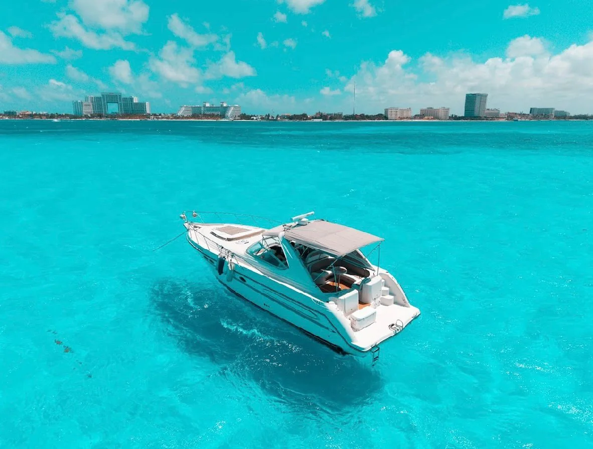 Aerial stern view of Blanco 46ft private yacht charter in Cancun