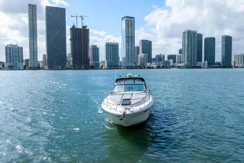 Genesis 38ft private yacht charter side profile on turquoise water in Cancun