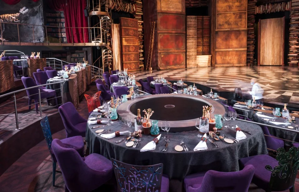 JOYÀ VIP dinner tables arranged beside the circular stage in Riviera Maya