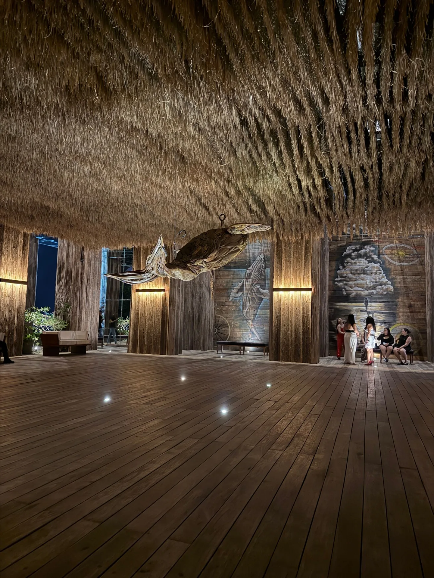 Whale sculpture and mural at La Madalena Cancun